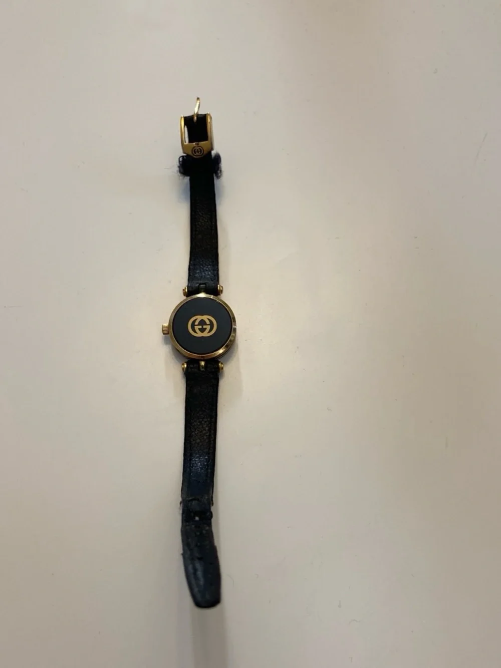 Gucci Black and Gold Round Dial Leather Strap Watch